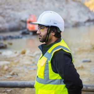 person in hard hat and hi-vis at construction site