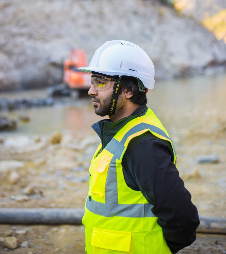 person in hard hat and hi-vis at construction site