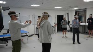Students wearing virtual reality gear on Swansea University trip