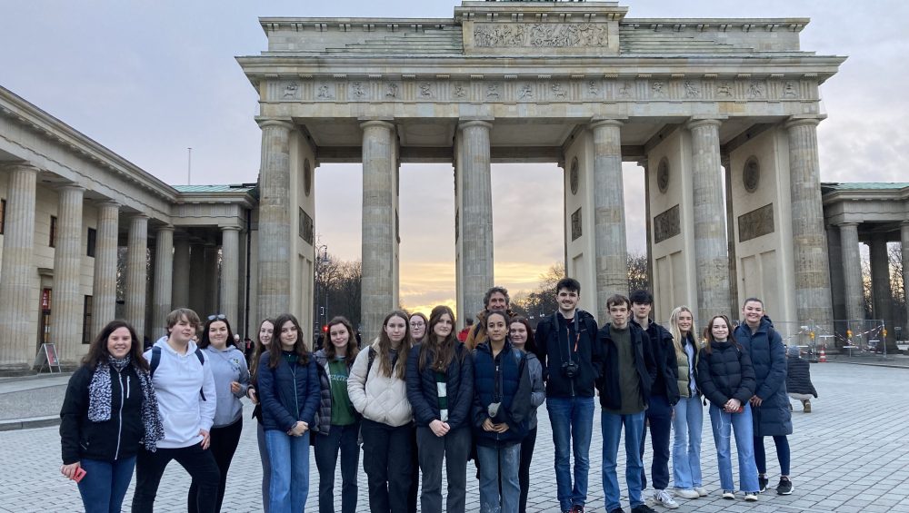 Students standing in front of The Brandenburg Gate, Berlin.