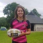 Marged Williams holding a rugby ball.