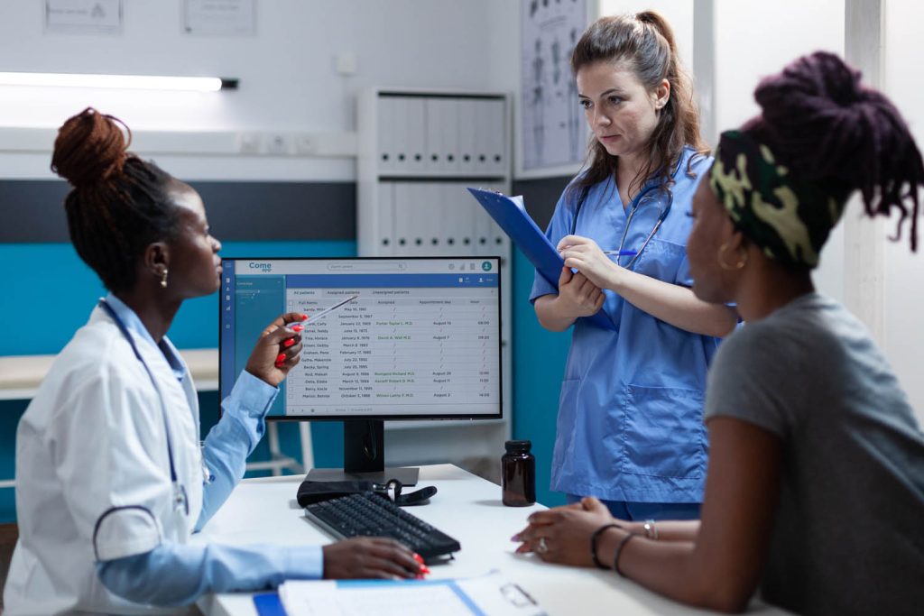 African american doctor discussing healthcare treatment with medical nurse