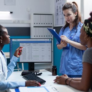 African american doctor discussing healthcare treatment with medical nurse