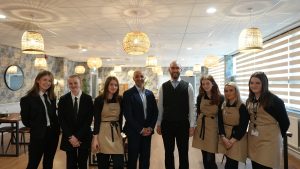 Hospitality learners in SEED Restaurant with Director of Operations, Mourad Tokfa.