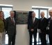 First Minister Mark Drakeford with Pembrokeshire College Principal Barry Walters, Nick Revell, Iwan Thomas and Engineering learner Rhiannon Chapham stood beside the Welding and Fabrication Centre of Excellence Plaque