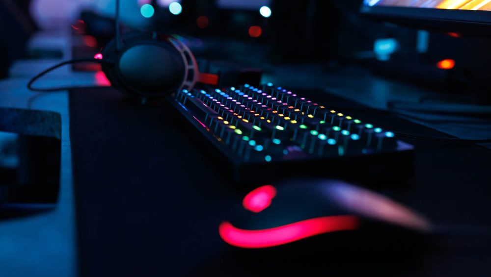 Computer mouse, keyboard, with neon lighting.