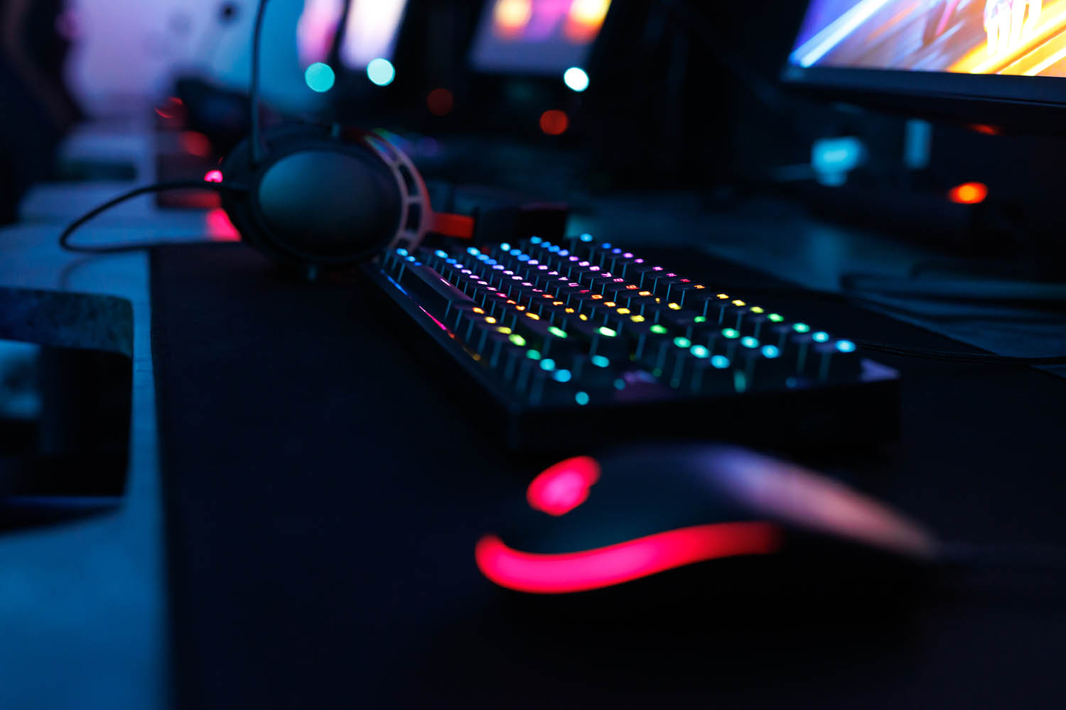Computer mouse, keyboard, with neon lighting.