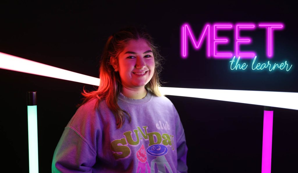 portrait of learner with neon text: meet the learner