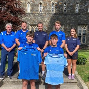 Staff and students outside UWTSD Academy of Sport.