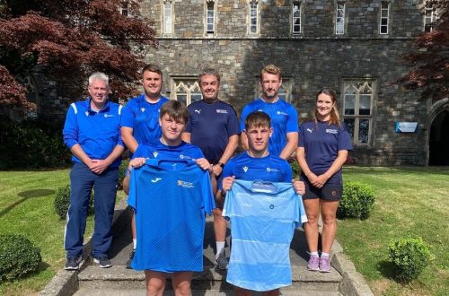 Staff and students outside UWTSD Academy of Sport.