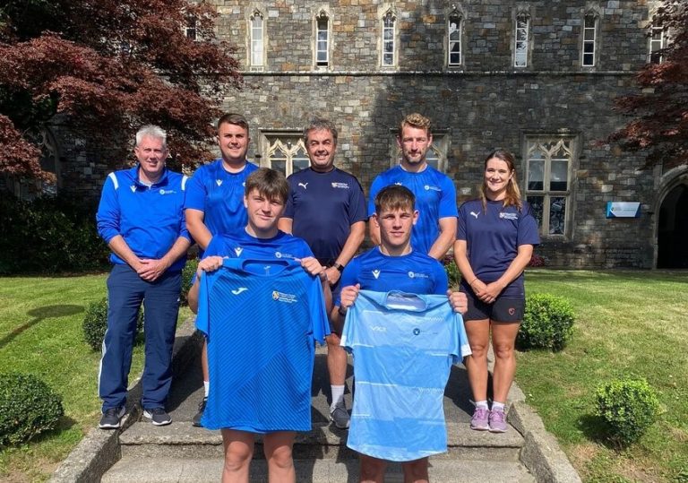 Staff and students outside UWTSD Academy of Sport.