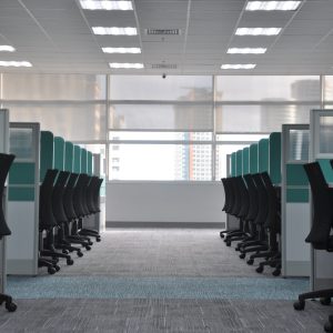 rows of desk cubicles in office