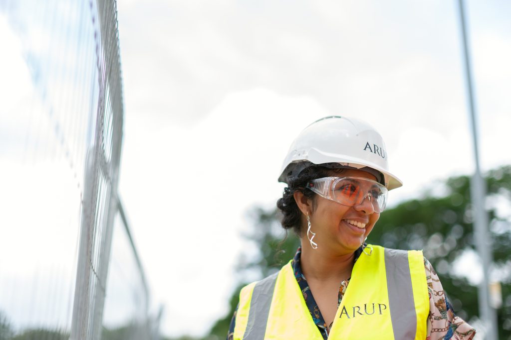 Person wearing a hard hat and high Visibility vest