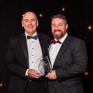 Arwyn from Pembrokeshire College collecting the scholar of the year award on behalf of Jordan Palmer with Paul Smith from Cavendish Nuclear who sponsored the award.