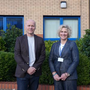 Architect Michael Pawlyn and Head of Built Environment Wendy stood smiling