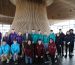 Competitors in the Senedd wearing hoodies and Vaughan Gething is centre