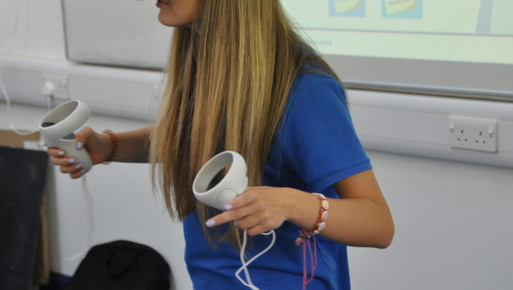 Student wearing virtual reality headset.