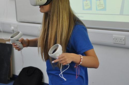 Student wearing virtual reality headset.