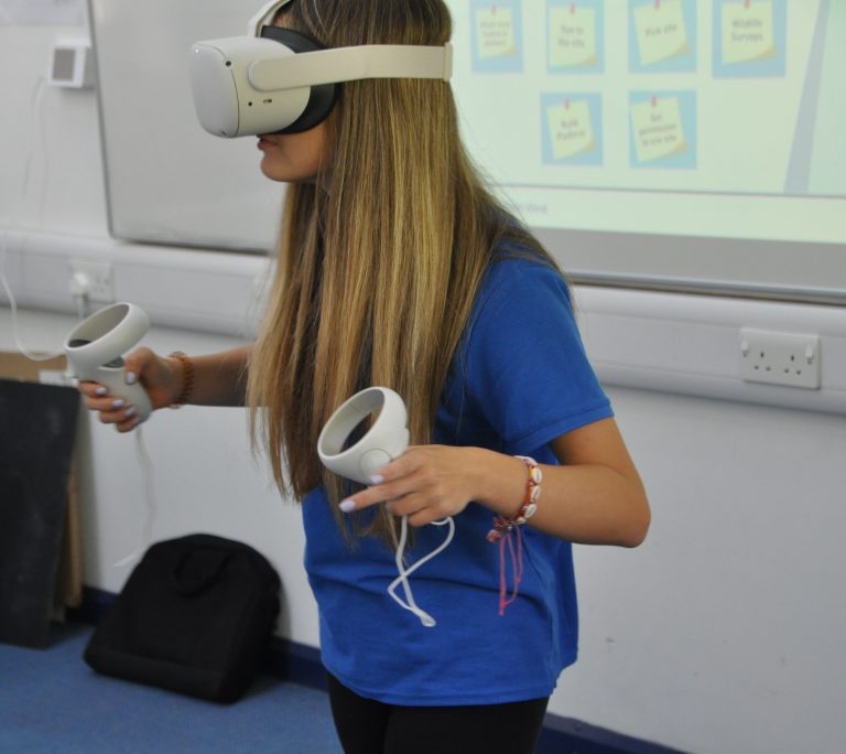 Student wearing virtual reality headset.