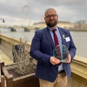 David Jones with his EDI Award. Pictured behind him is the London Eye on the River Thames