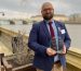 David Jones with his EDI Award. Pictured behind him is the London Eye on the River Thames