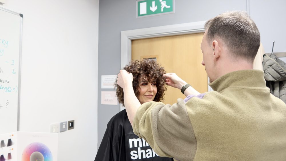 Ambassador Scott Thomas, styling a models hair