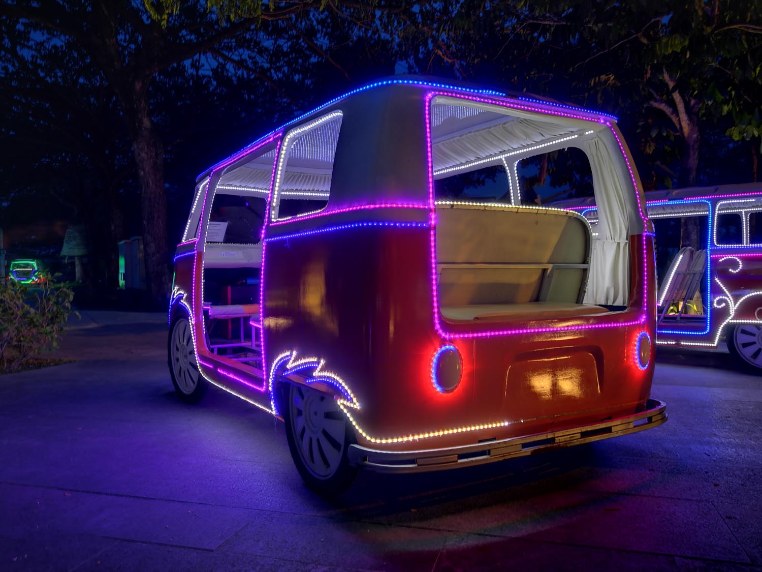 old van covered in neon lights