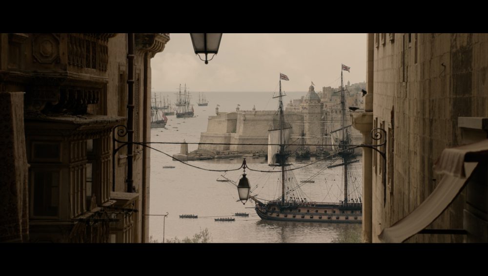Apple Original Film Clip from the Napoleon Movie with a ship of the water and in the foreground beige buildings