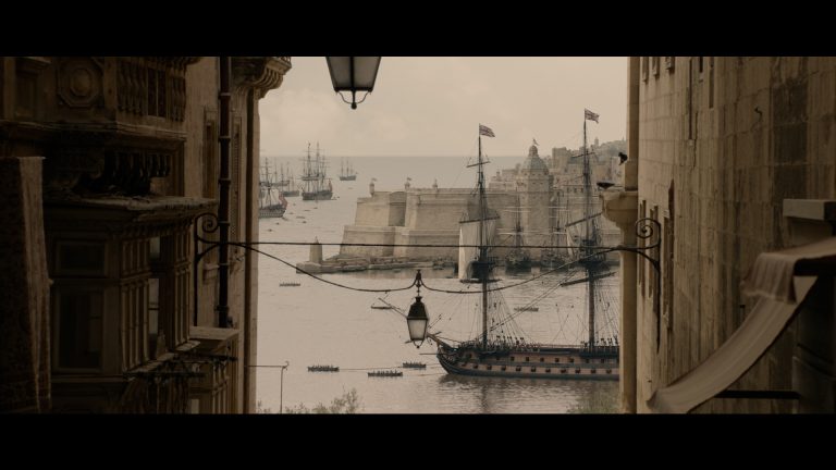 Apple Original Film Clip from the Napoleon Movie with a ship of the water and in the foreground beige buildings