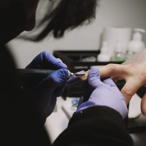 Therapist Filing Nails