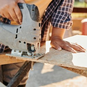 man on site using a saw