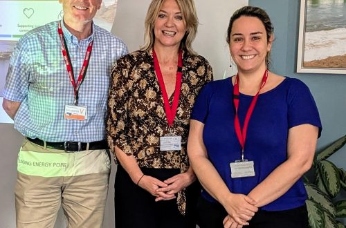Rob Hiller, Hayley Williams and Luciana Ciubotariu standing in front wow classroom whiteboard