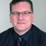 Portrait photo of Guy Woodham