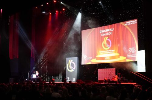 Stage with large screen with text Gwobrau Awards 2025