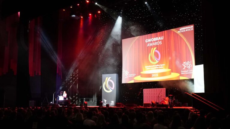 Stage with large screen with text Gwobrau Awards 2025