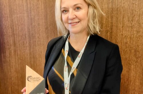 Portrait of Hayley holding award