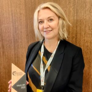 Portrait of Hayley holding award