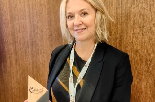 Portrait of Hayley holding award
