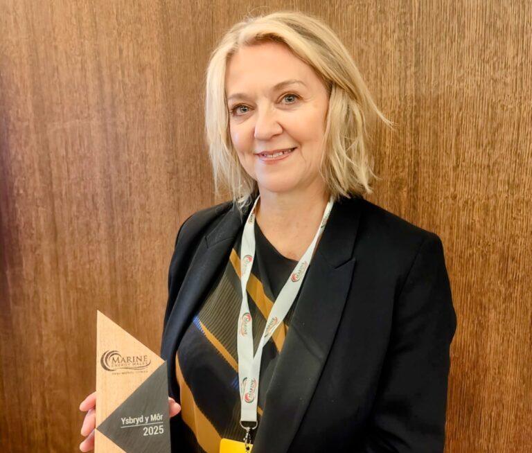Portrait of Hayley holding award