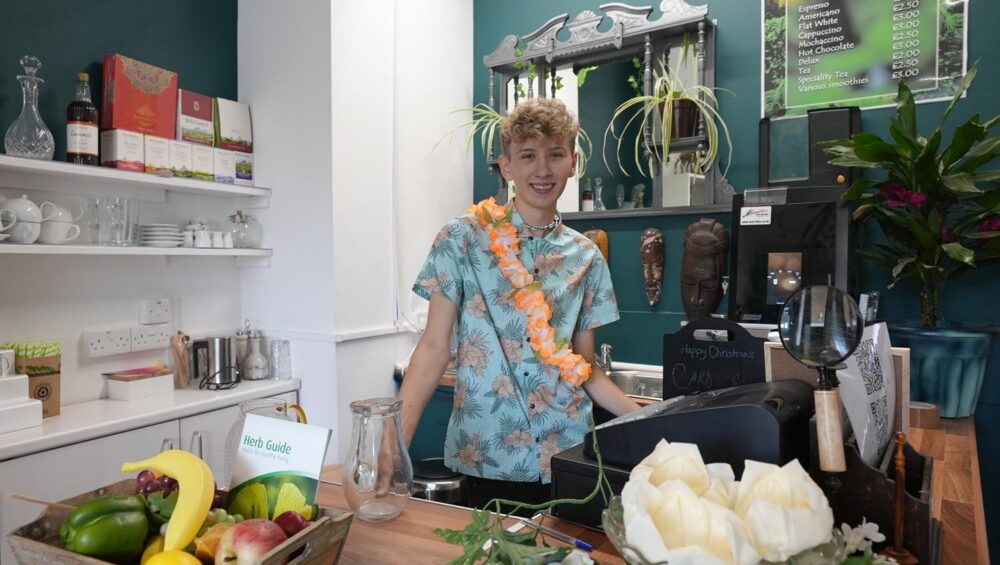 Student in cafe kitchen.