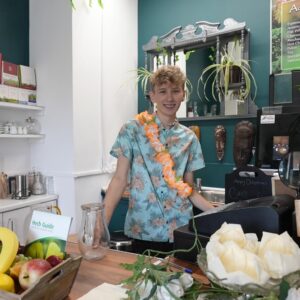 Student in cafe kitchen.