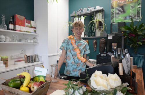 Student in cafe kitchen.