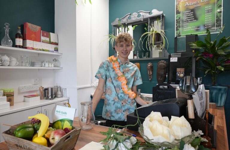 Student in cafe kitchen.
