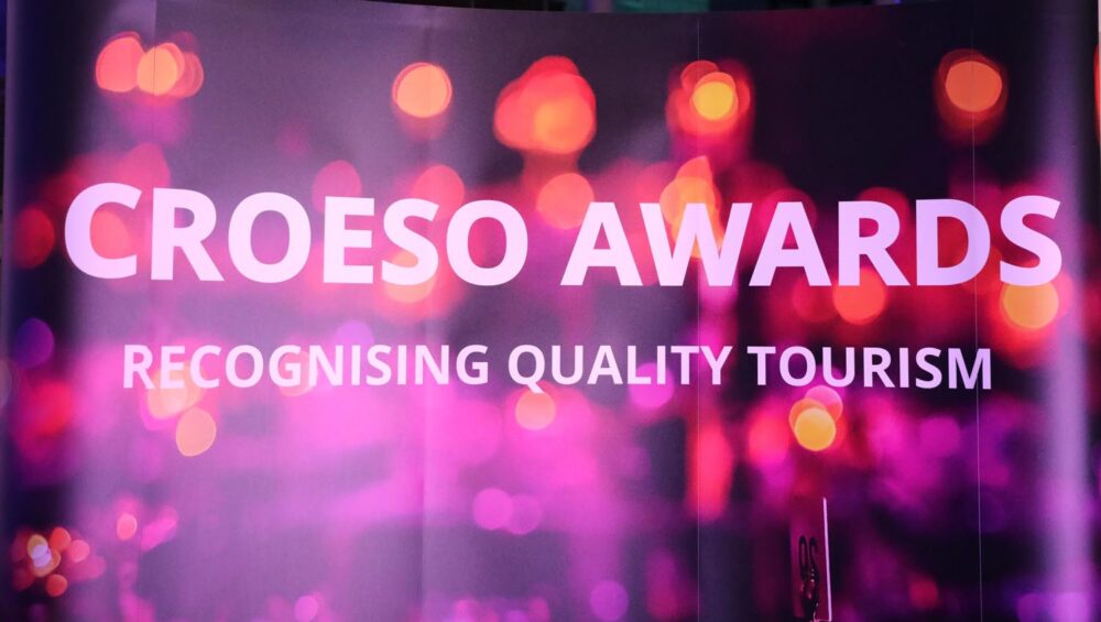 Neon background. Text 'Croeso Awards'