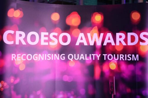 Neon background. Text 'Croeso Awards'