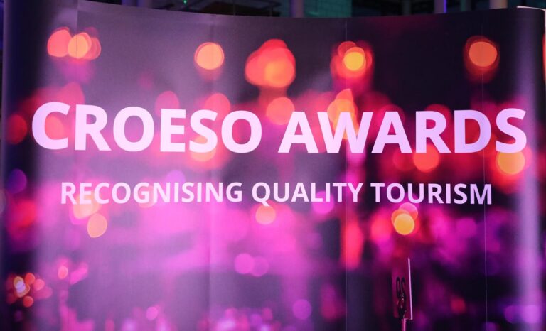 Neon background. Text 'Croeso Awards'
