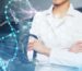 Doctor with stethoscope and folded arms next to image of DNA helix.
