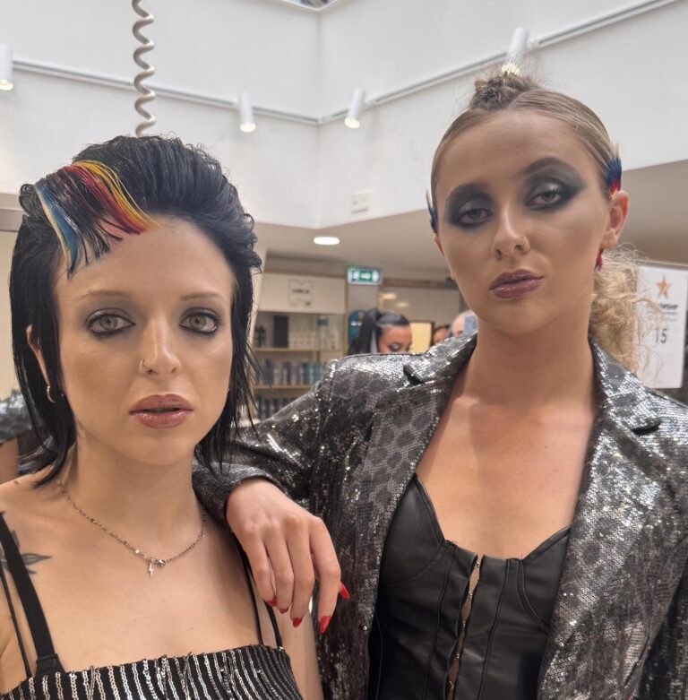 Two people with unique hairstyles and rock chic look.