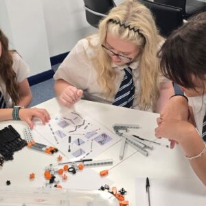 Group of students around a table.