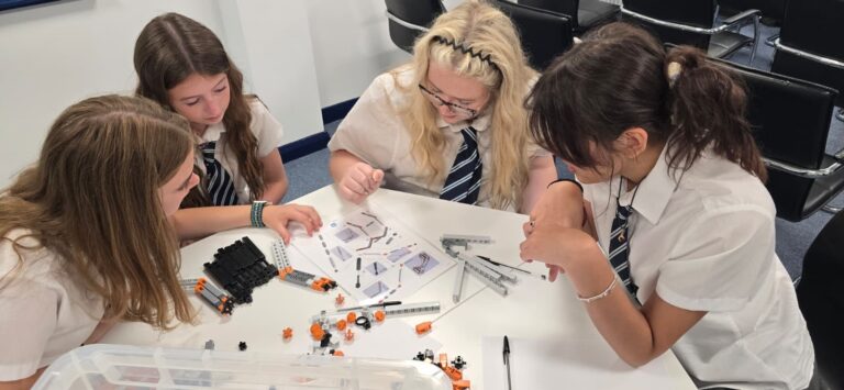 Group of students around a table.